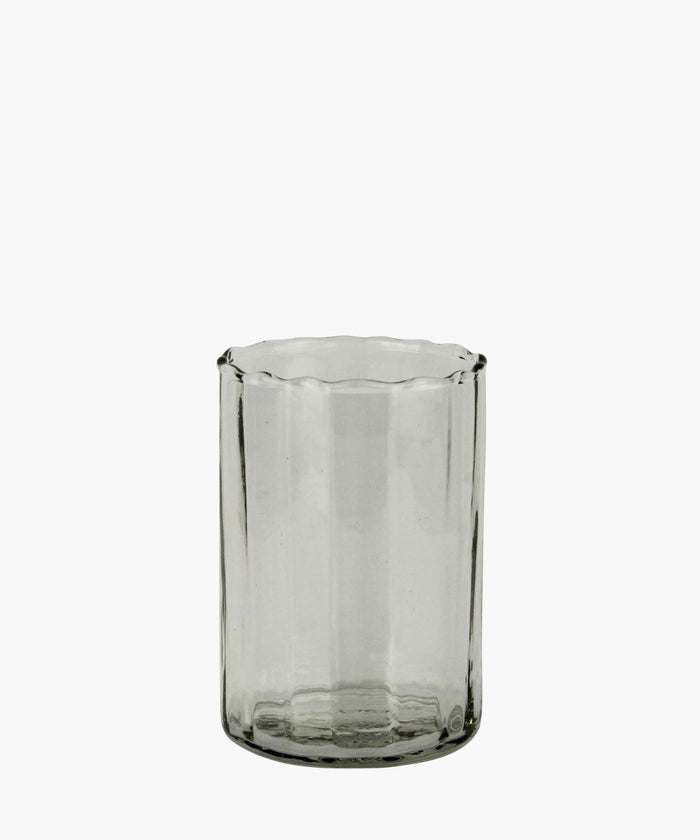 Clear Cylindrical glass with ribbed texture on a white background. | SW Home