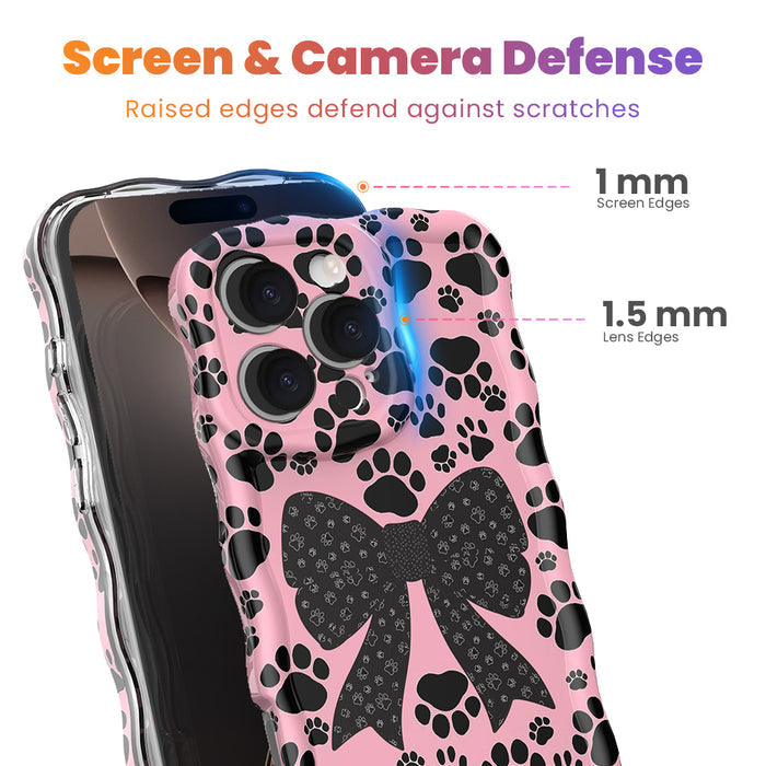 Trendy pink wavy iPhone case featuring a pattern of black paw prints and a large central black bow with tiny paw print details.