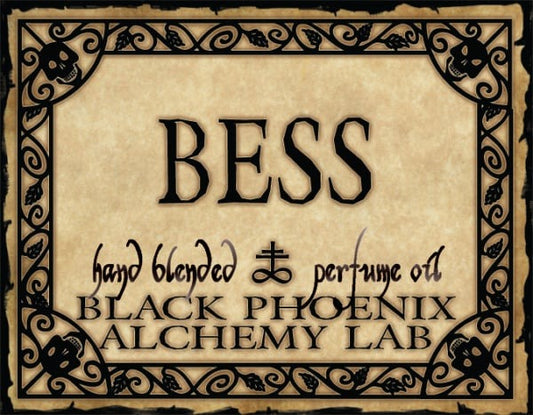 Label for 'BESS' hand blended perfume oil by Black Phoenix Alchemy Lab with decorative border.