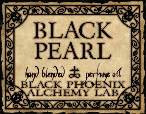 Label for Black Pearl hand blended perfume oil by Black Phoenix Alchemy Lab with decorative border.