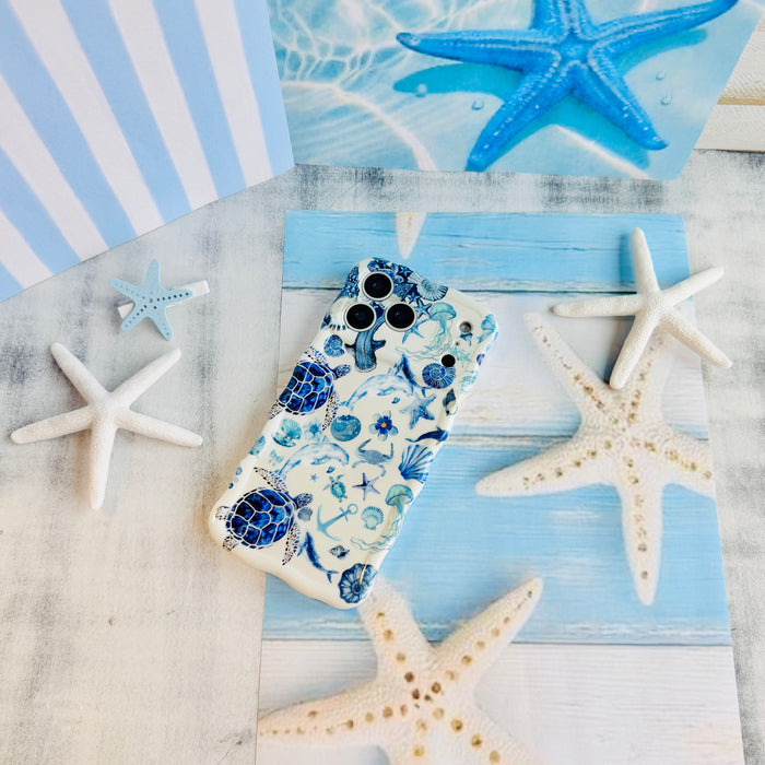 Blue Lagoon nautical watercolor MagSafe phone grip ring with sea turtles, whales, and jellyfish in shades of blue on a white background compatible with iPhone and Samsung