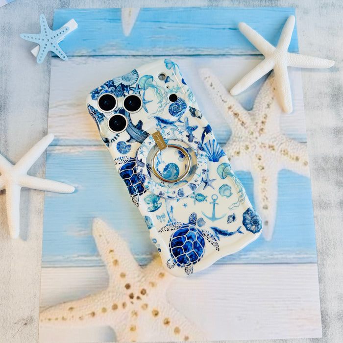 Blue Lagoon nautical watercolor MagSafe phone grip ring with sea turtles, whales, and jellyfish in shades of blue on a white background compatible with iPhone and Samsung