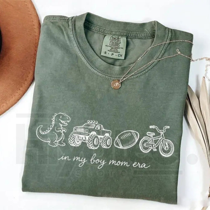 Boy Mom Era Graphic T-Shirt – Trendy Sports Mama Tee, Cute Dino & Truck Theme Shirt for Moms - Teezioo