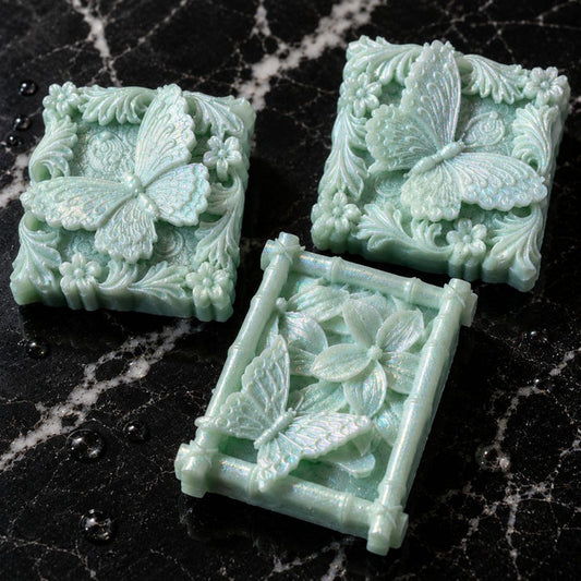Three Citrus Papillon butterfly guest soaps handcrafted with green tea, argan oil, and camellia oil by Southern Luxe Savon