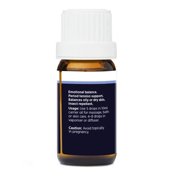 Back view of bottle of geranium essential oil with label on a white background. Displaying benefits, usage and cautions.