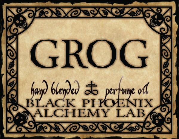Label for 'Grog' hand blended perfume oil by Black Phoenix Alchemy Lab with decorative border.