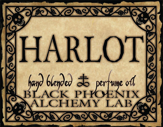 Label for 'Harlot' hand blended perfume oil by Black Phoenix Alchemy Lab with decorative border.