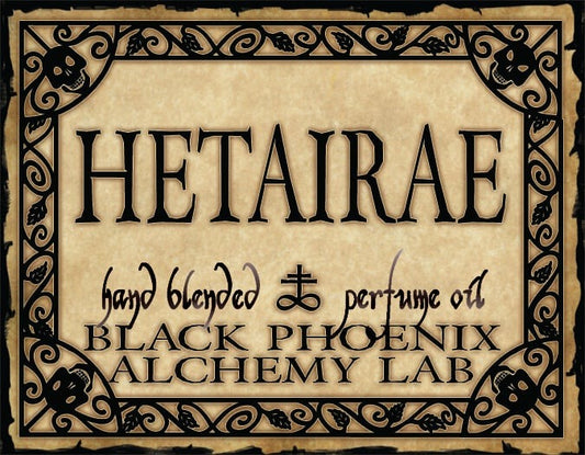 Label for 'Hetairae' perfume oil by Black Phoenix Alchemy Lab with decorative border.