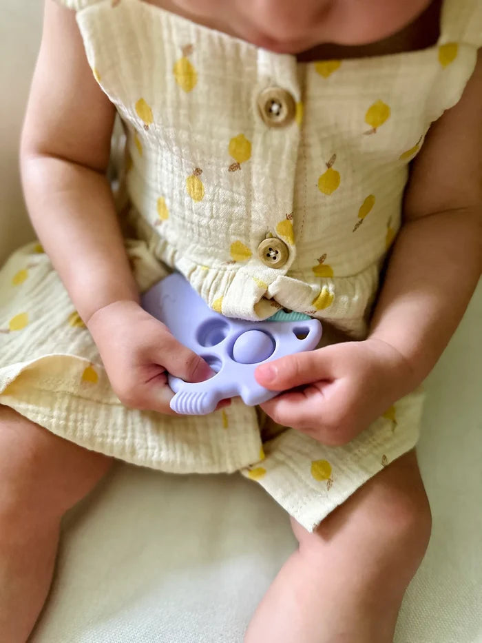 Itzy Ritzy Itzy Pop Sensory Popper Toy - Lilac Dino
