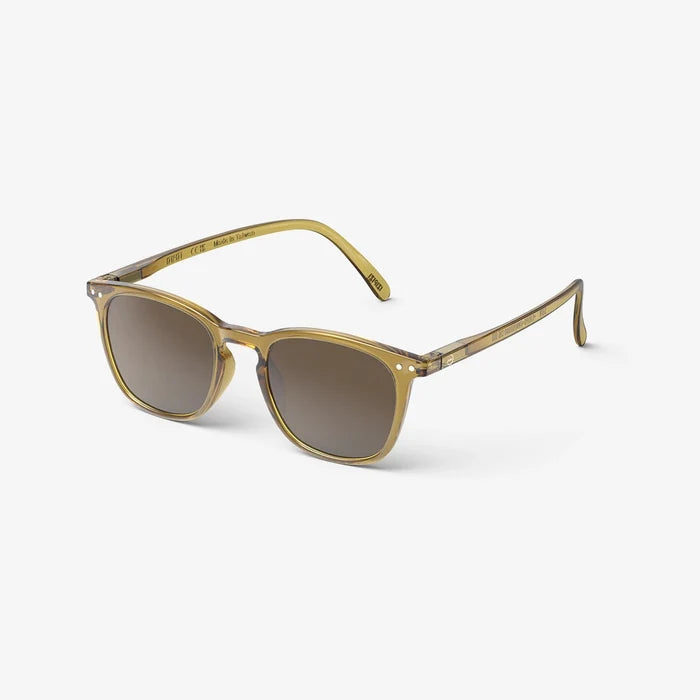 A pair of IZIPIZI #E sunglasses with golden green frames and lenses, featuring a flexible arm design.