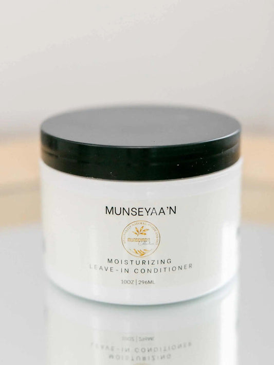 Moisturizing Leave-In Cream bottle with natural oils and shea butter for dry, damaged hair hydration and strengthening