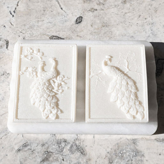 Two Moonlit Tryst peacock guest soaps handcrafted with tussah silk and argan oil by Southern Luxe Savon in shimmering white