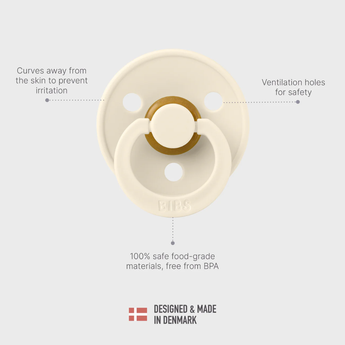 Beige pacifier with text highlighting features on a light gray background