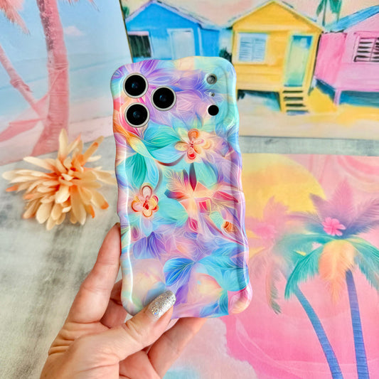 Trendy wavy iPhone case featuring an iridescent swirly pattern in pastel pink, blue, yellow, and lavender with a high-gloss finish.