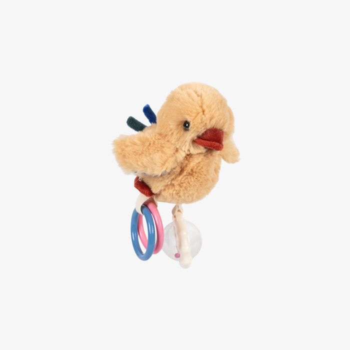 Plush toy chick with rattle on a white background