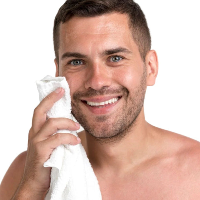 White man brown hair white towel in hand. Best anti-aging face serum with hyaluronic acid.  Dermal Essentials Medical Grade.