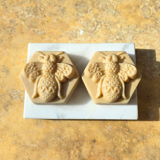 Two Royal Miel Queen Bee guest soaps with raw Manuka honey, rich butters and calendula on a soap dish by Southern Luxe Savon