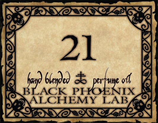 Label for a hand blended perfume oil by Black Phoenix Alchemy Lab with decorative border and text.